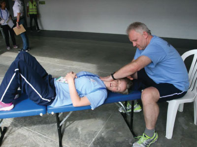Rainer Wieser treating fellow chiropractor at Columbia World Games 2013